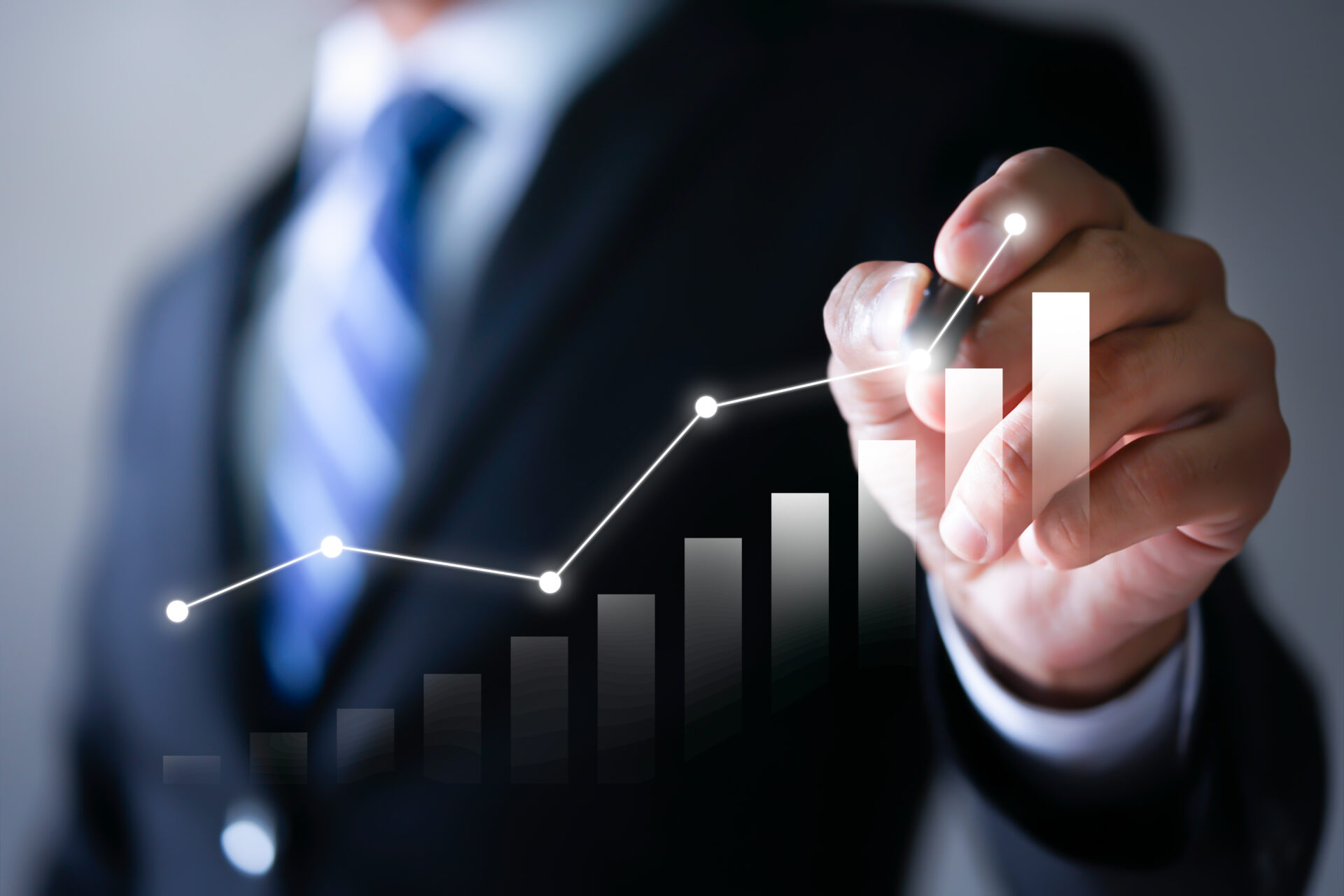 image of businessman hand pointing at a chart showing increase